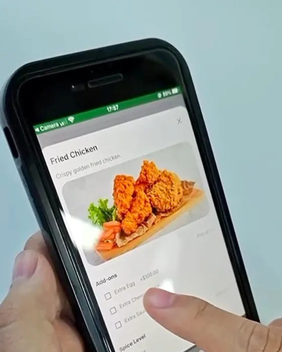 Add-ons on every item: Extras and options, like spice level, are picked on the phone.