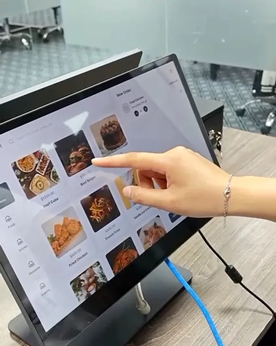A counter built for speed: Big photo tiles on the terminal for counter and takeaway orders.